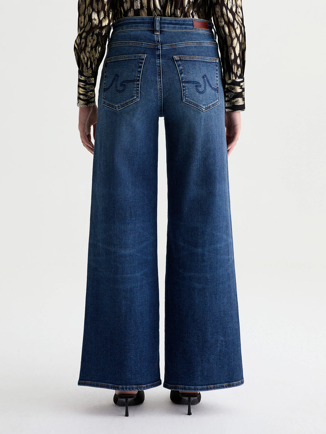Back view of AG Saige Wide Leg jeans in 14 Years Bluegrass medium dark wash denim
