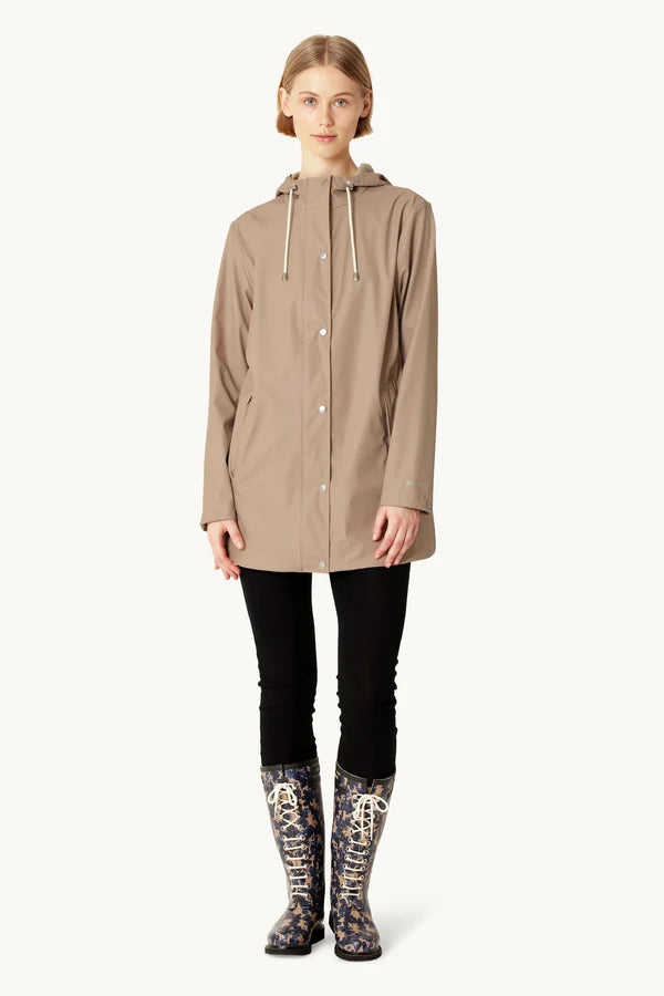 Ilse Jacobsen Rain 228 taupe hooded raincoat with snap buttons, worn with floral boots