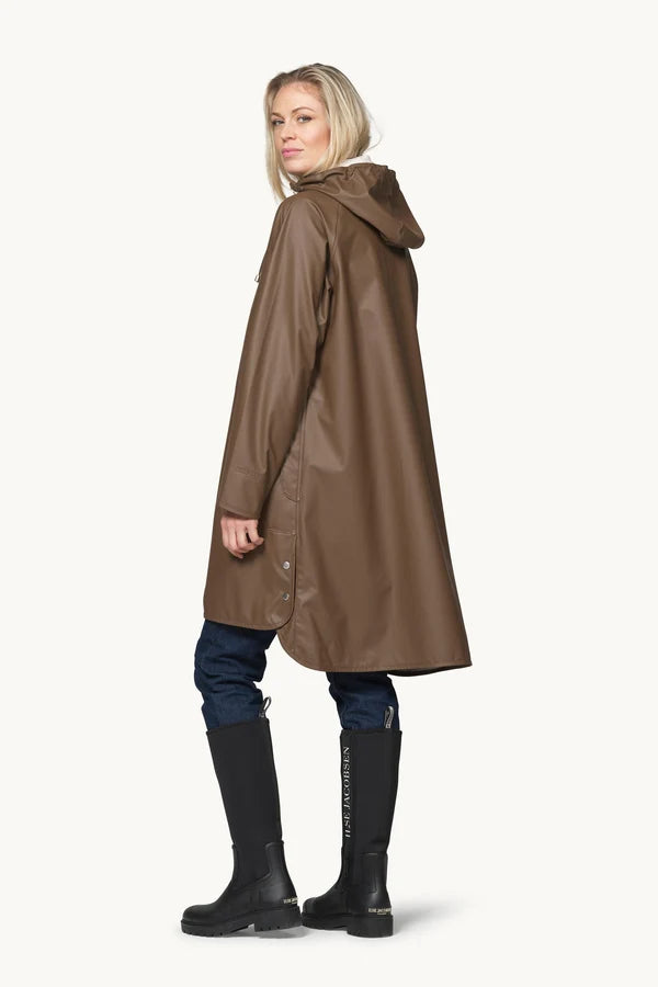 Ilse Jacobsen RAIN71 brown hooded raincoat, A-line silhouette, worn with black tall boots