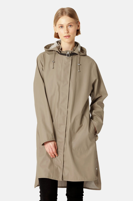 Ilse Jacobsen RAIN71 wheat hooded raincoat in taupe, knee-length, worn by model