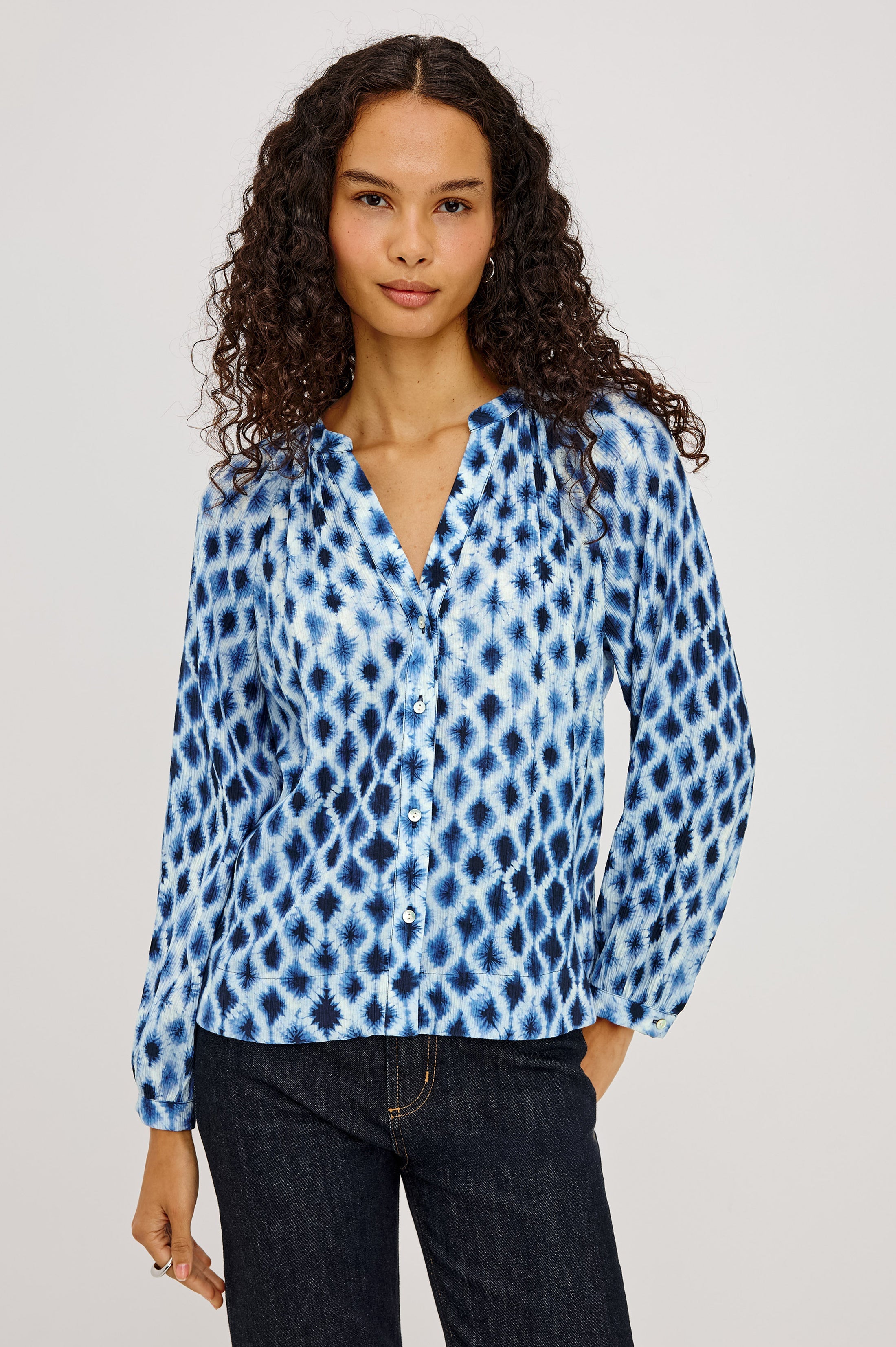Model wearing Rails Saint blouse in Sapphire Shibori blue ikat print with long sleeves