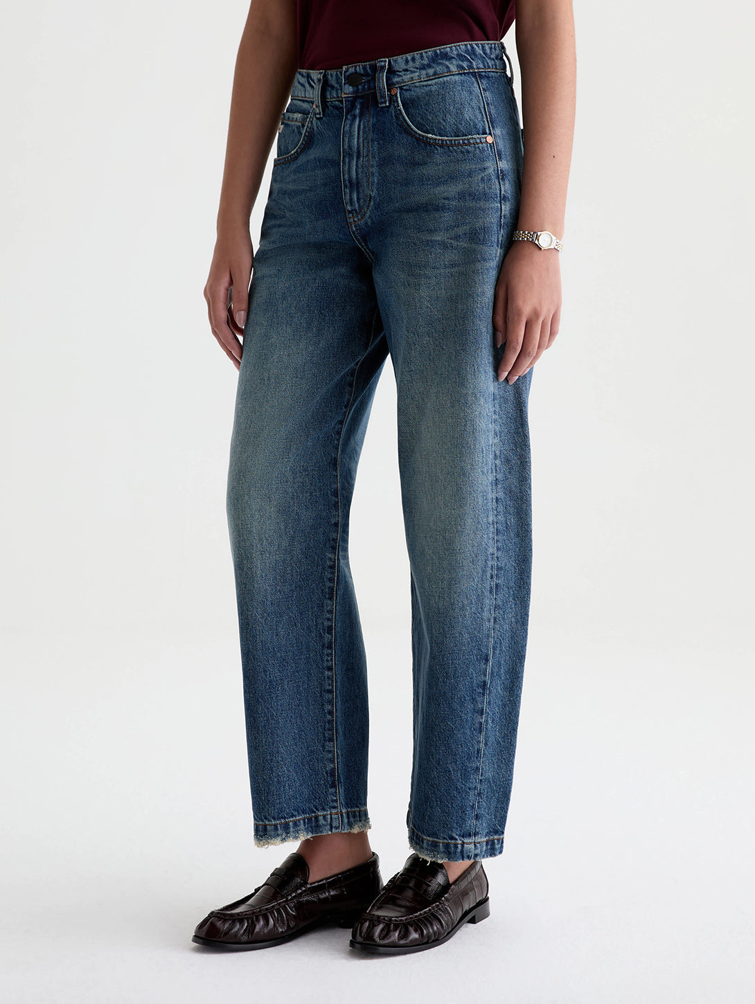 AG Hattie jeans in 10 Yrs Front Line medium blue wash worn with dark loafers