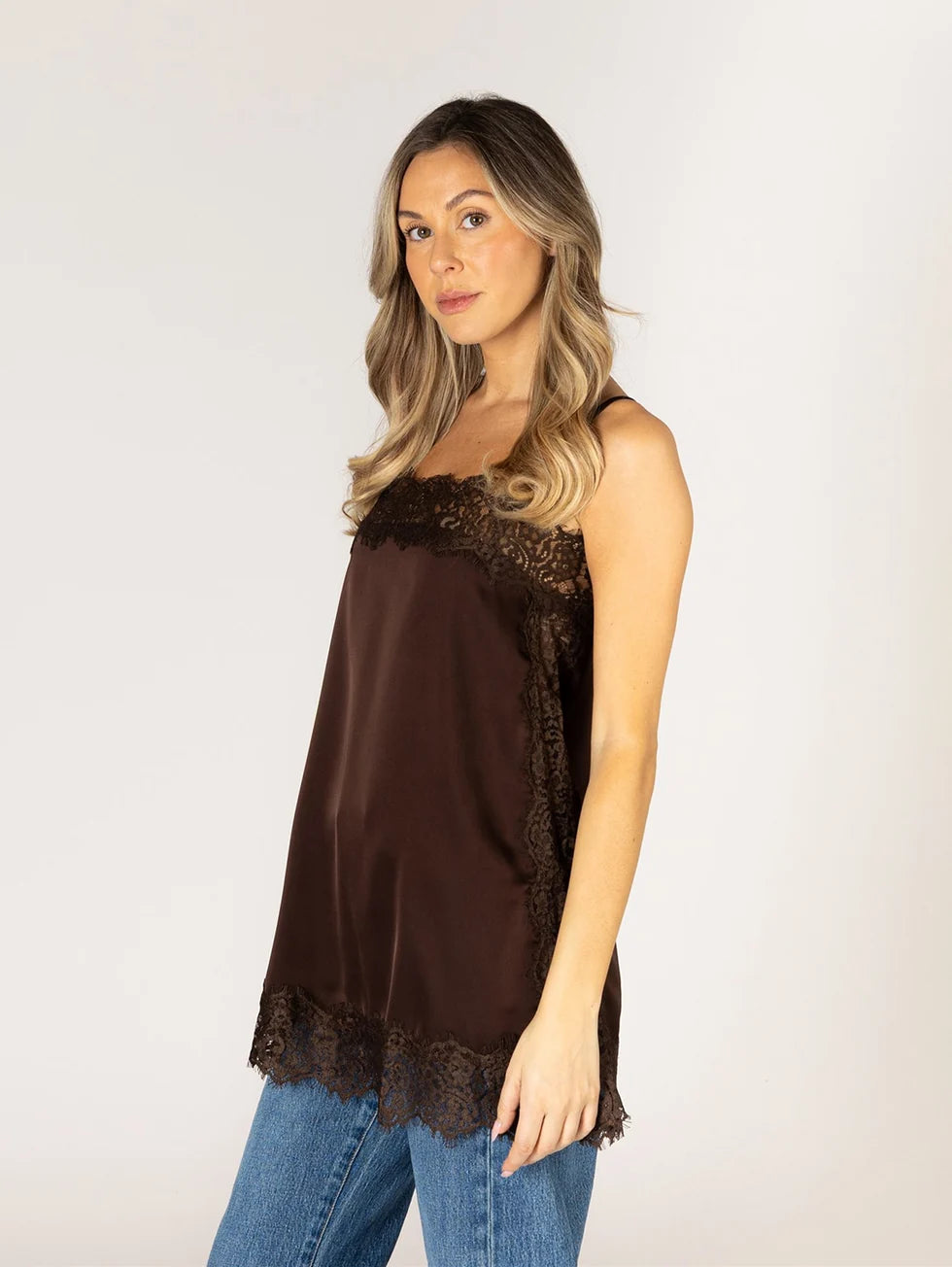Chocolate brown satin lace-trim cami top with scalloped hem, worn with jeans