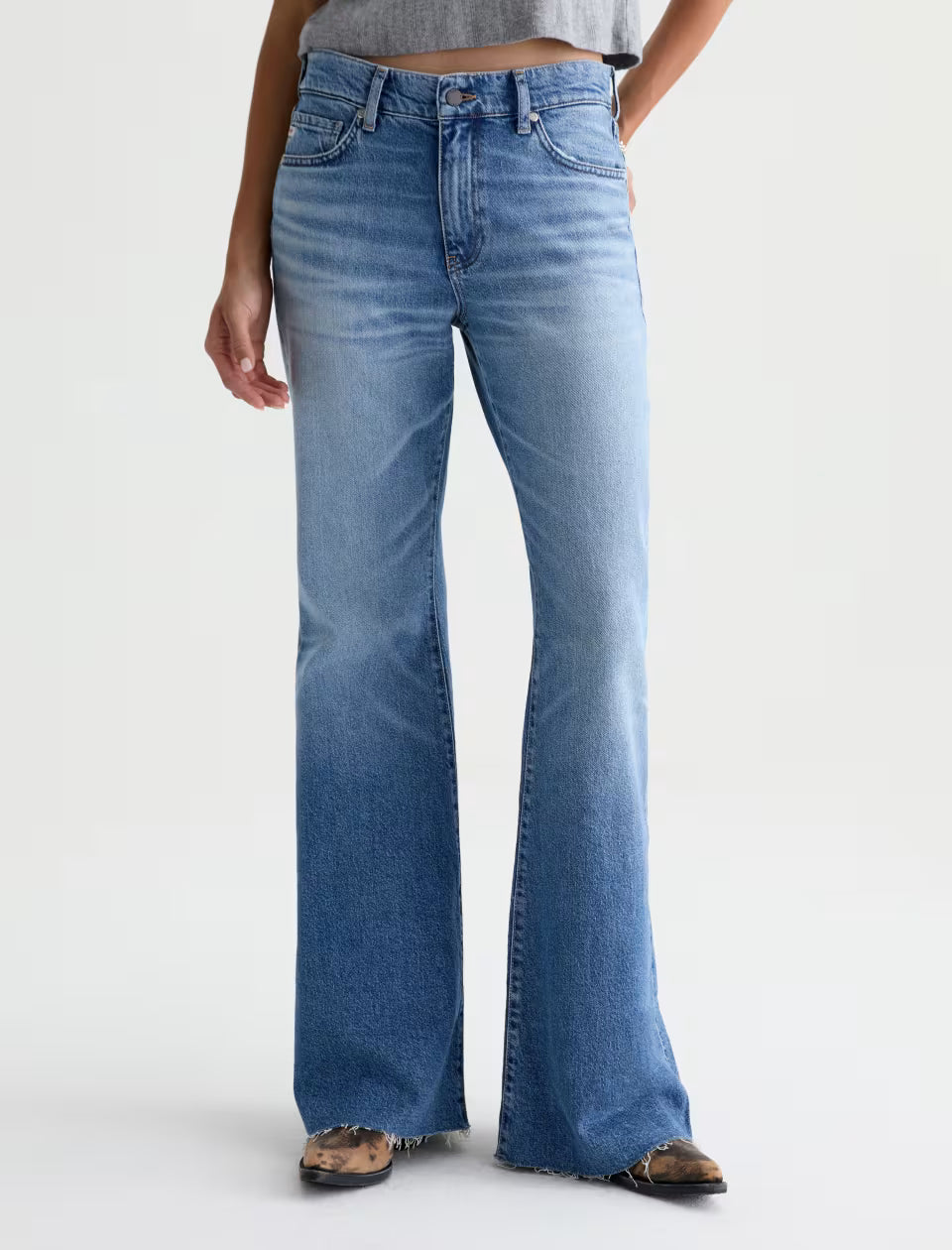 AG Georgia wide-leg flare jeans in medium blue wash with raw hem