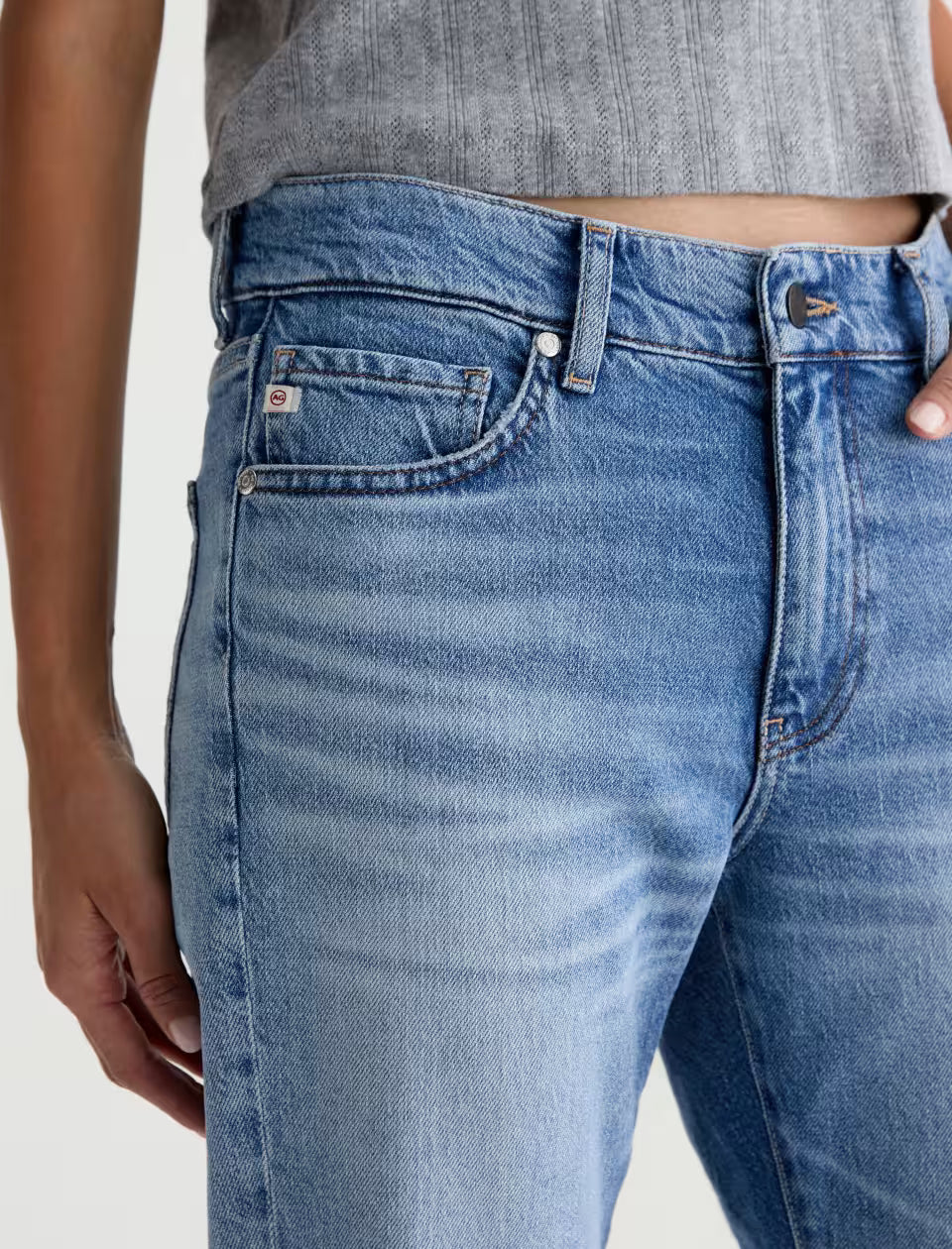 AG medium blue wash straight-leg jeans with coin pocket, silver hardware