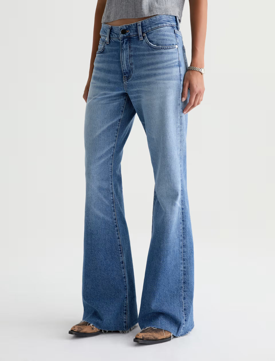 AG Georgia wide-leg flare jeans in medium blue wash with raw hem