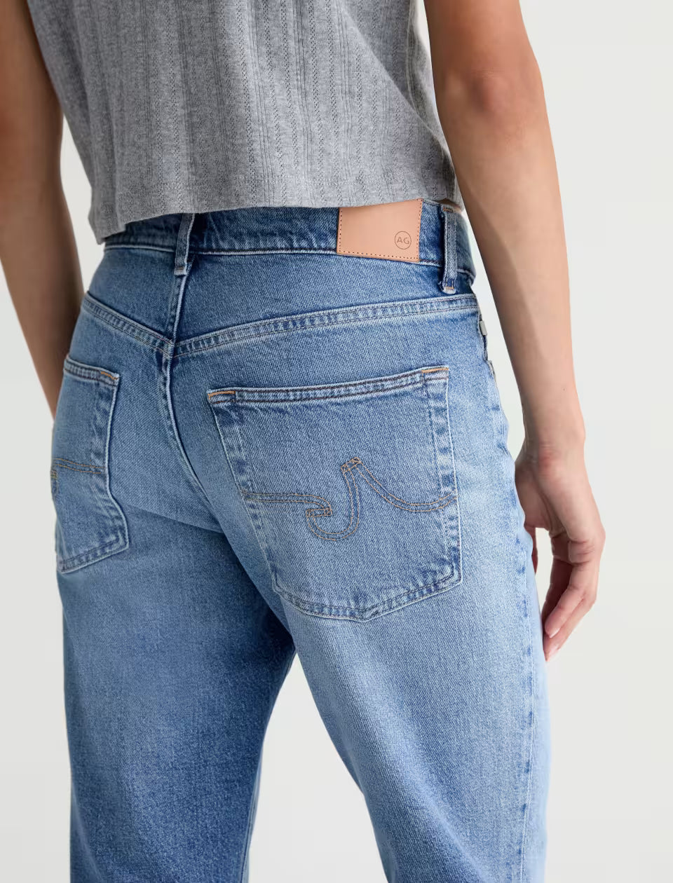 AG Georgia mid-rise straight jeans in light blue wash, back pocket view
