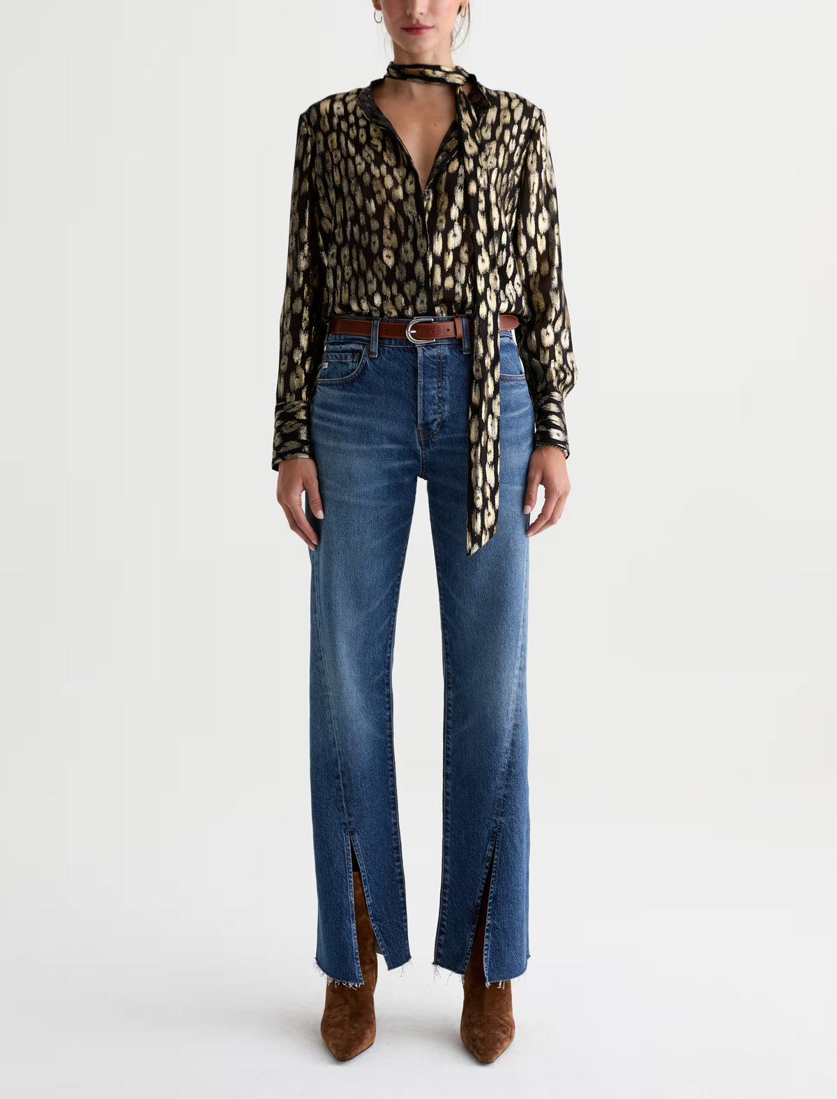 AG Sydney high-rise stovepipe jeans in medium blue wash with raw-cut hem and front slits