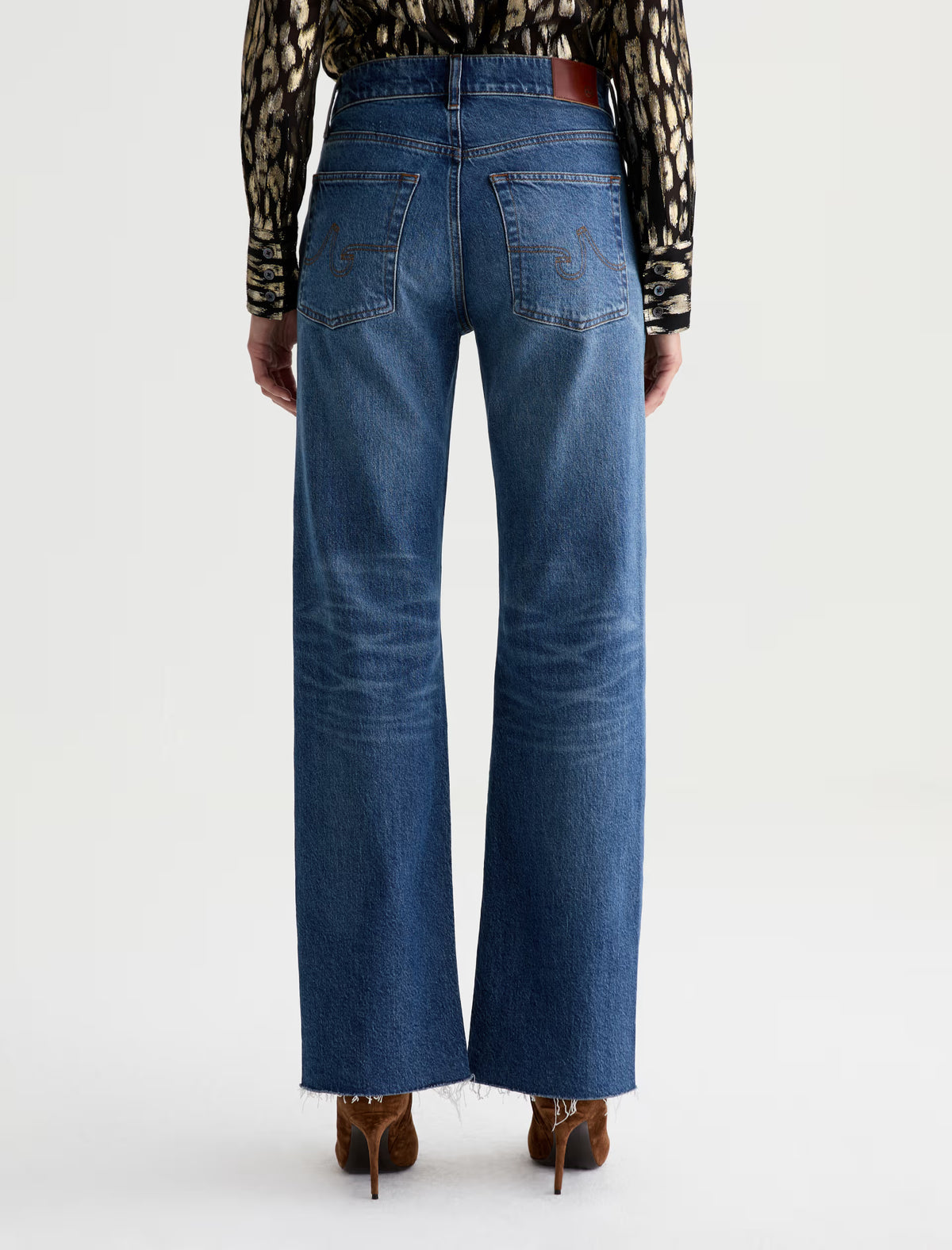 AG Sydney wide-leg jeans in mid-blue denim with raw hem, back view