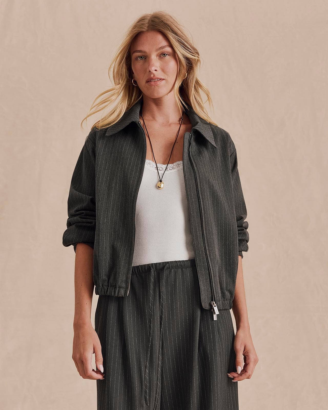 Model wearing Splendid Blake Pinstripe Jacket in charcoal over white camisole and matching pants
