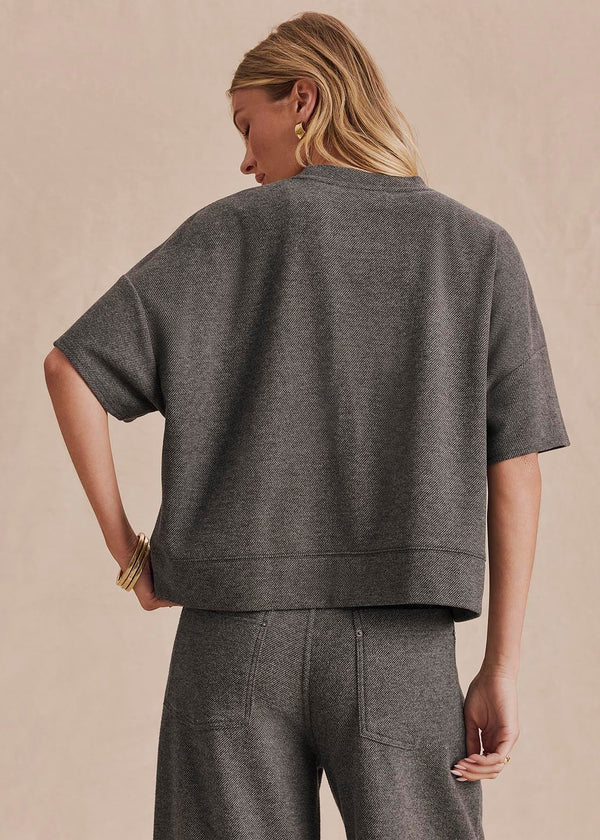 Gray herringbone knit cropped short-sleeve top with banded hem, back view