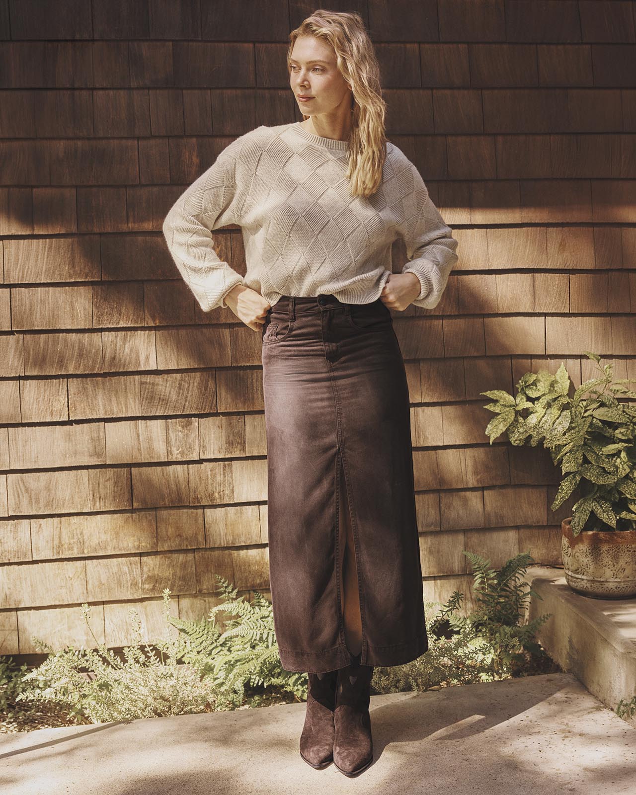Model wearing Splendid Solstice Sweater in Wheat Heather with diamond knit pattern and long brown skirt