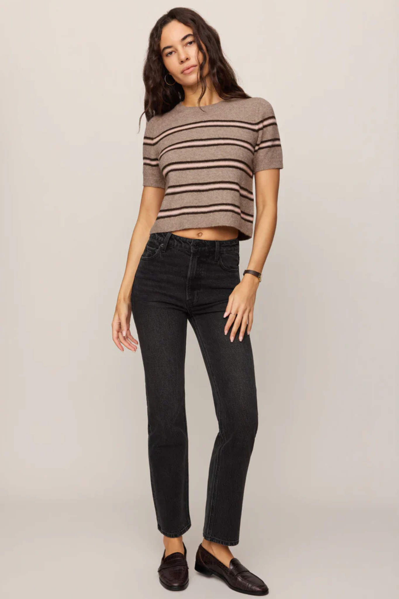Model wearing Z Supply Gatewood Stripe Sweater in Heather Ash with black jeans and loafers