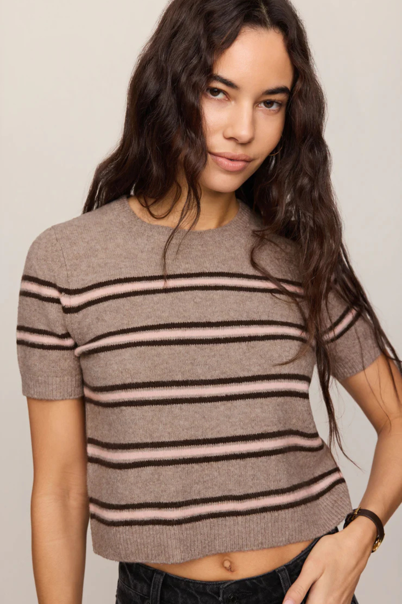 Model wearing Z Supply Gatewood Stripe Sweater in Heather Ash with pink and brown stripes