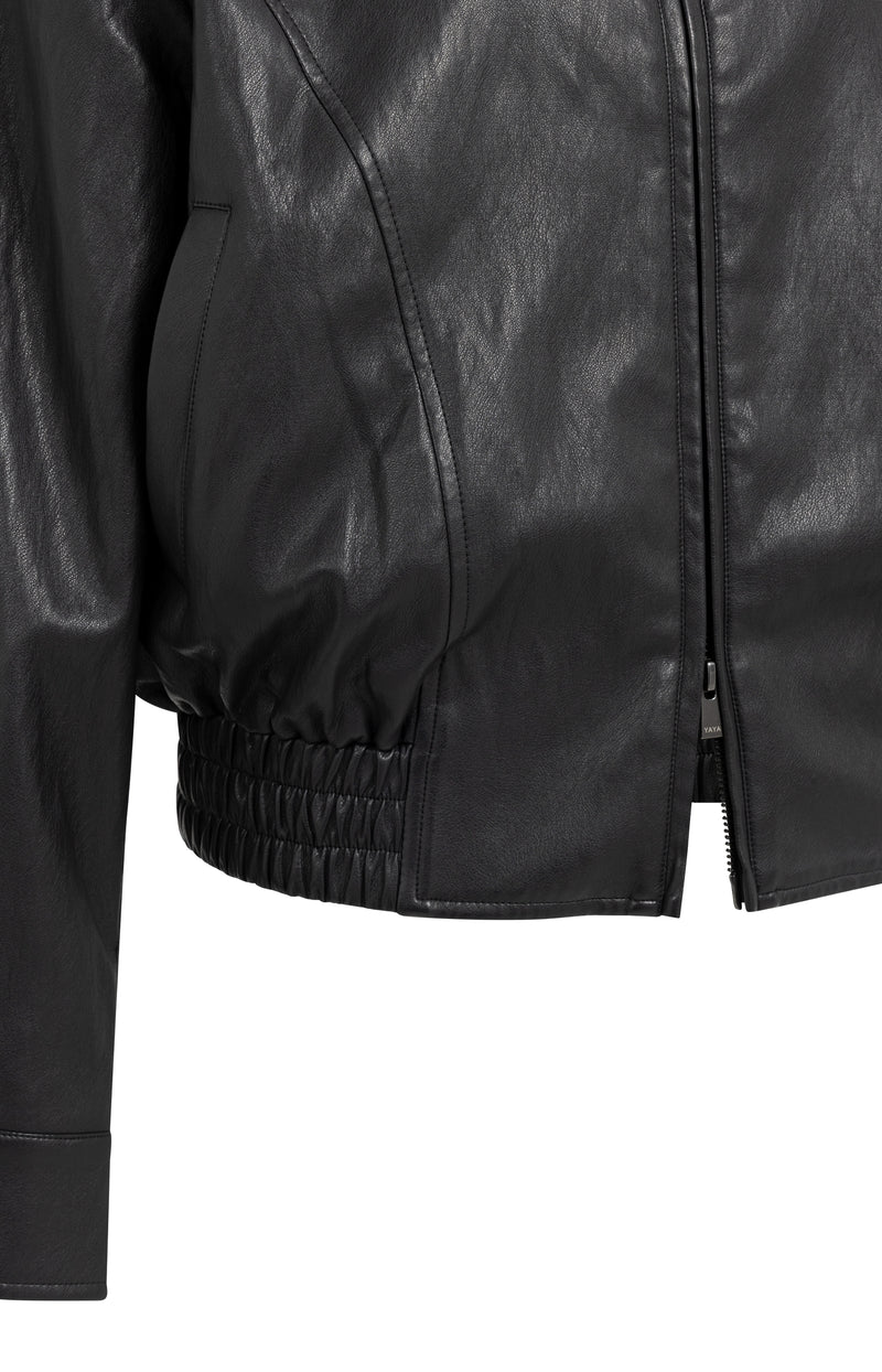 Black faux leather cropped jacket detail showing zipper and elasticated hem