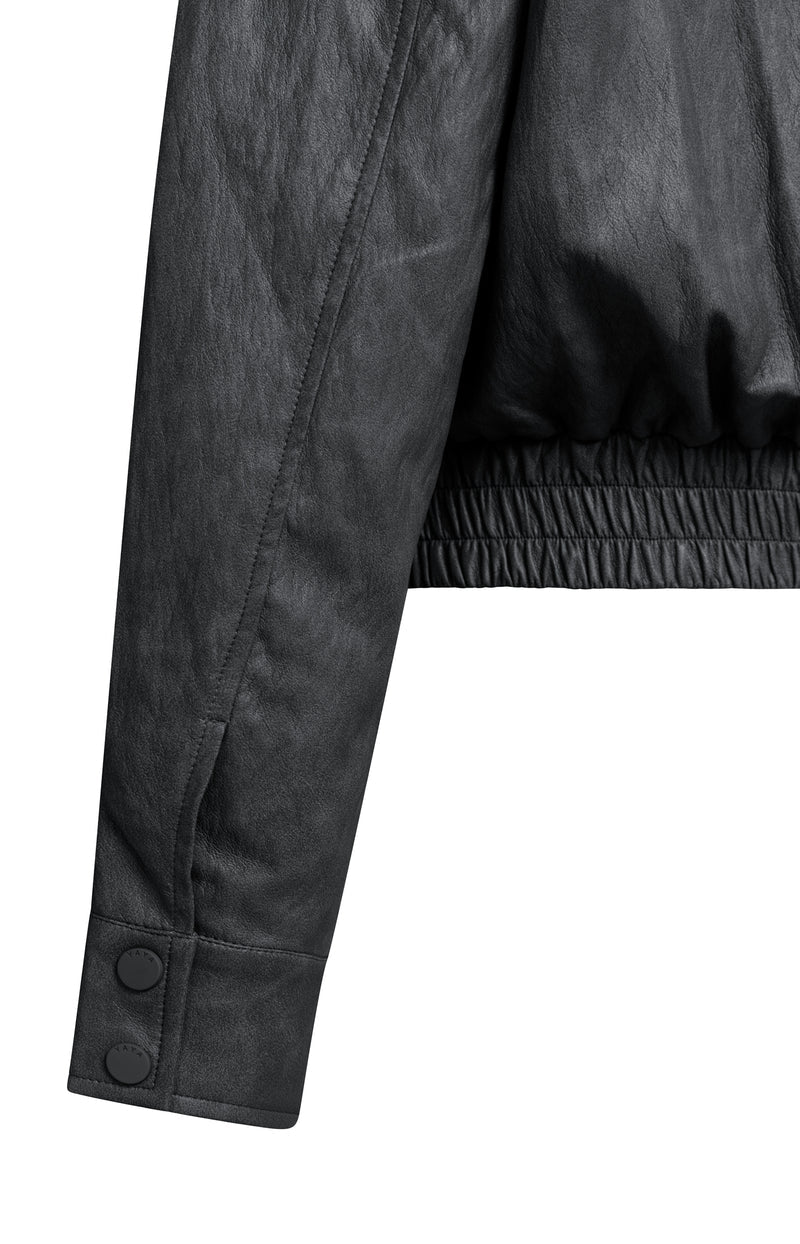 Black faux leather cropped jacket sleeve with snap buttons and elastic hem