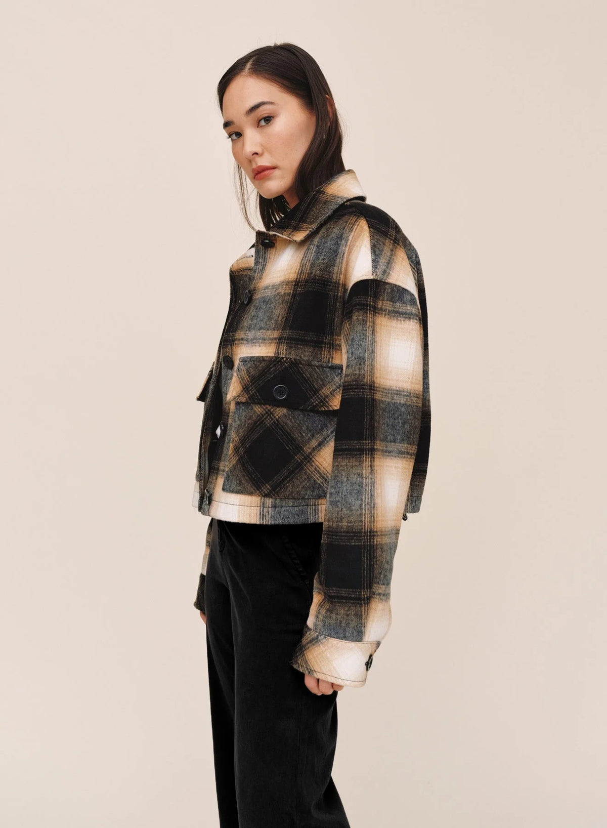 Bella Dahl cropped plaid flannel jacket in black, tan, and white check pattern