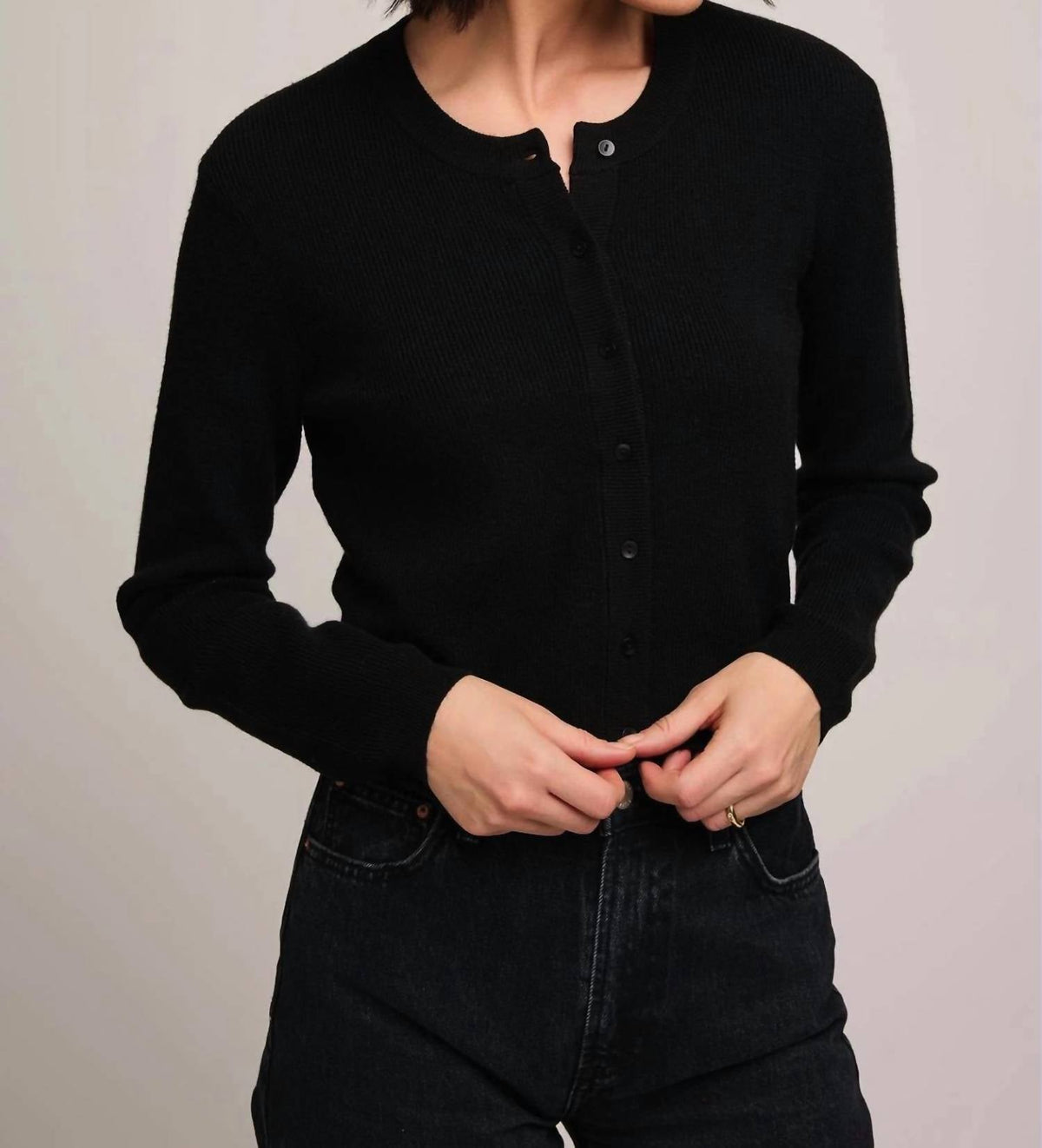 Model wearing Gentle Fawn Mirabelle black ribbed button-front cardigan with long sleeves