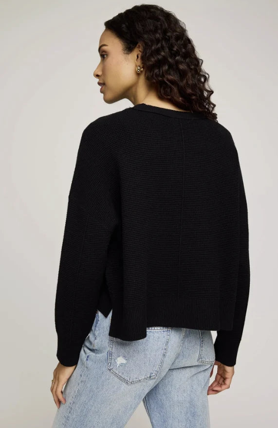Black chunky knit pullover sweater with ribbed texture, shown from the back