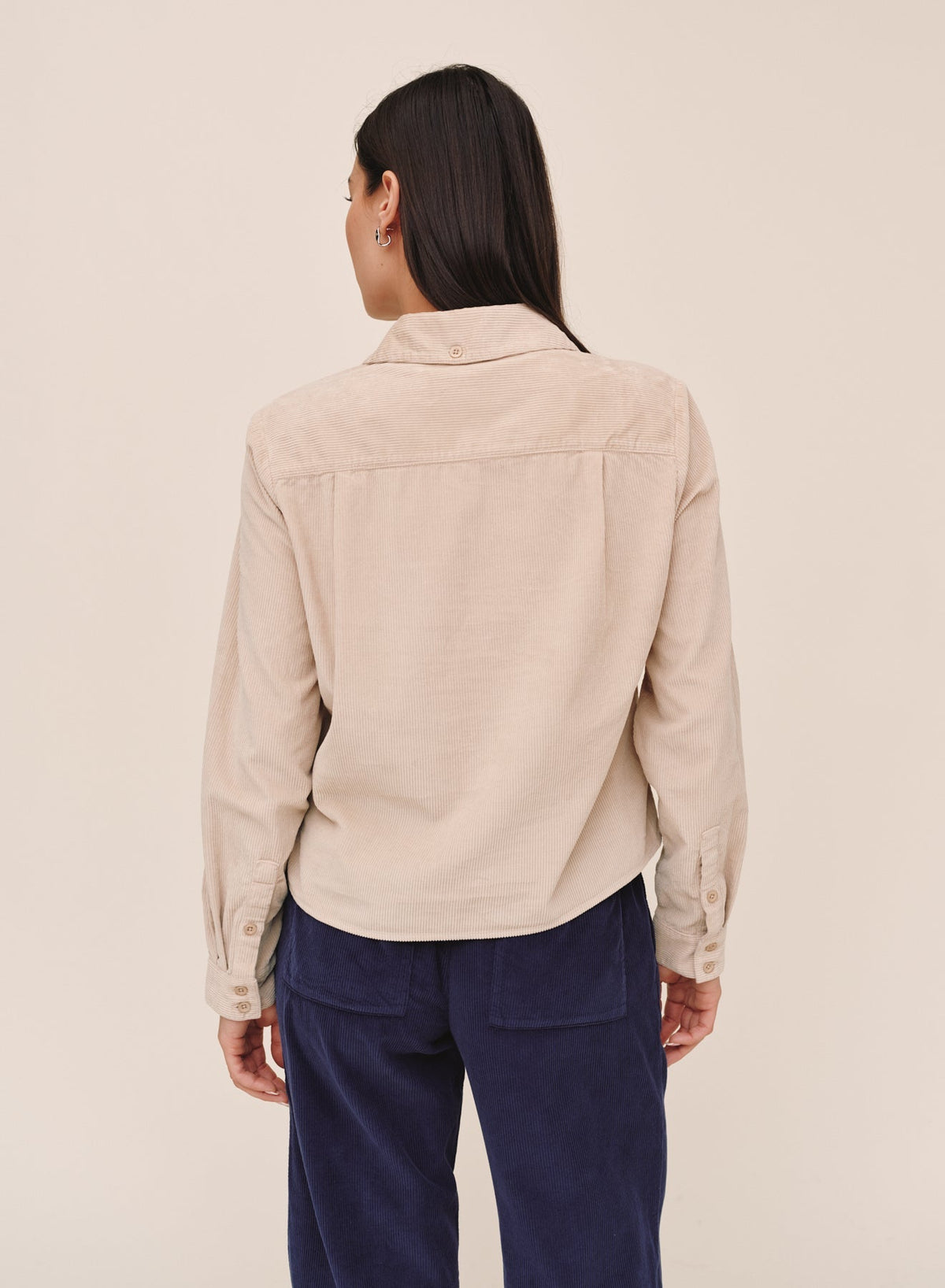 Back view of Bella Dahl long sleeve corduroy work shirt in oat beige with button cuffs