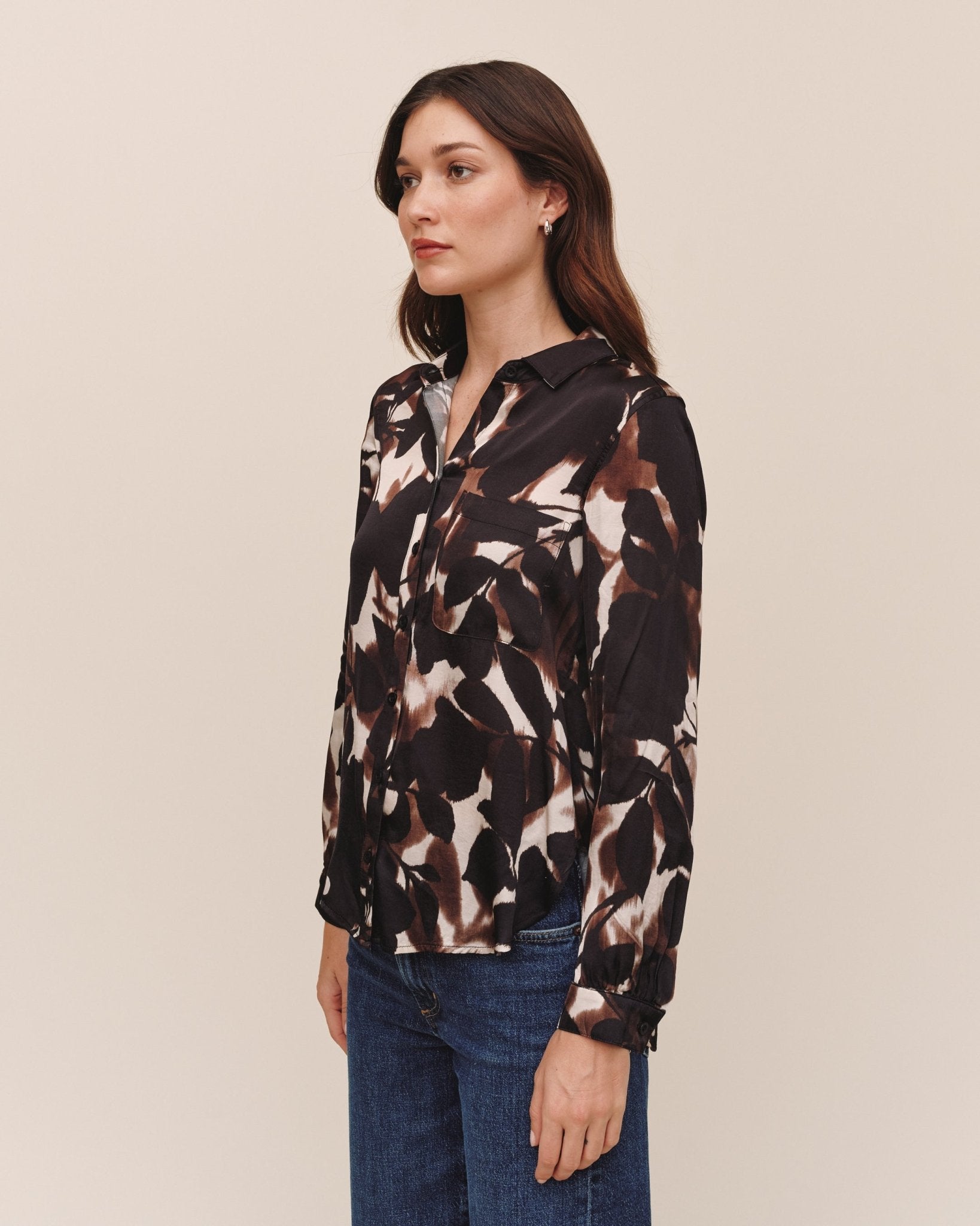 Model wearing Bella Dahl long sleeve button down blouse in Shadow Floral Print, side view