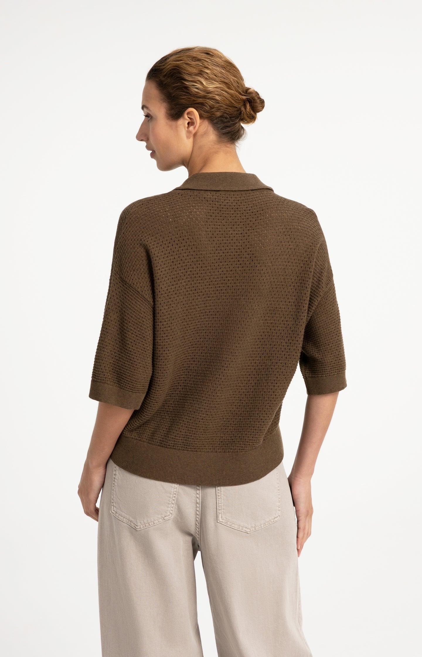 Back view of model wearing YAYA mesh stitch short sleeve cardigan in teak brown melange