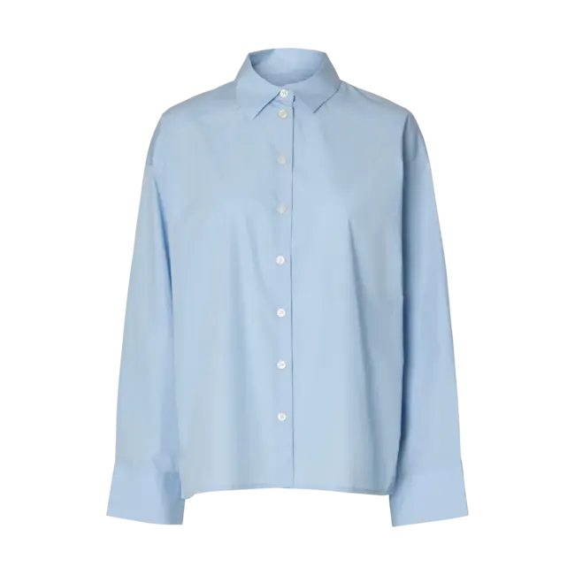 Light blue oversized long-sleeve button-up shirt with classic collar and white buttons