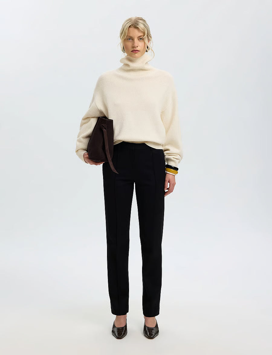 Cream oversized turtleneck knit sweater with ribbed cuffs and hem