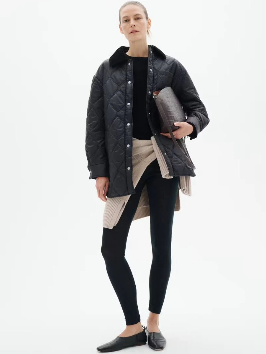 Black quilted oversized shirt jacket with corduroy collar and snap button closure