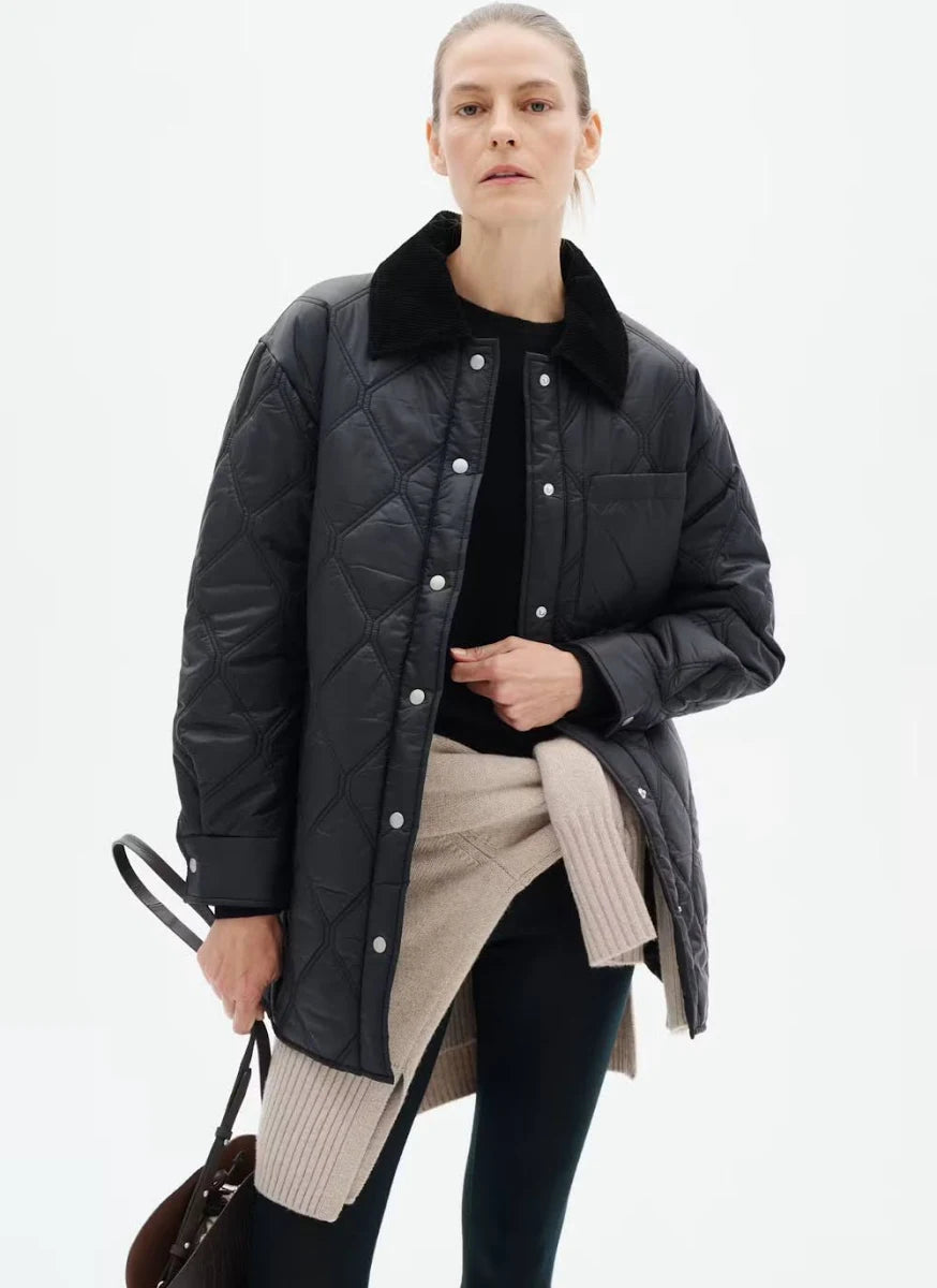 Black quilted shirt jacket with corduroy collar and silver snap buttons