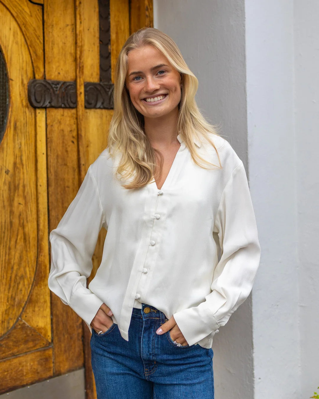 Women's relaxed white satin long sleeve button-up shirt with V-neckline