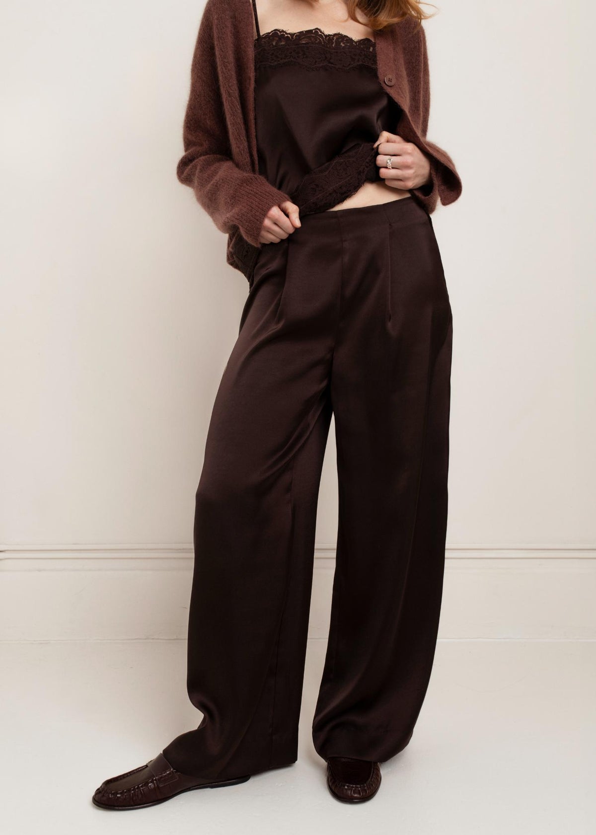 Model wearing Paper Label Cindy Pant in Chocolate Torte with matching satin cami and brown cardigan