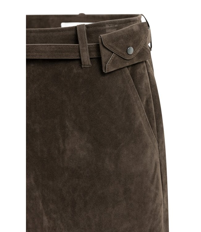 Close-up detail of brown suedine mini skirt showing fancy belt with small snap-closure pouch