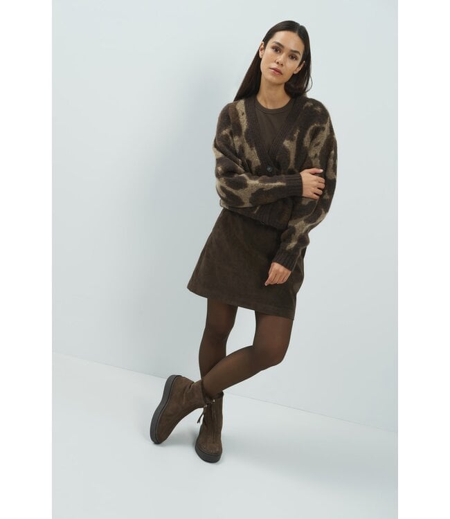 Model wearing YAYA suedine mini skirt in Delicioso Brown styled with patterned cardigan and boots