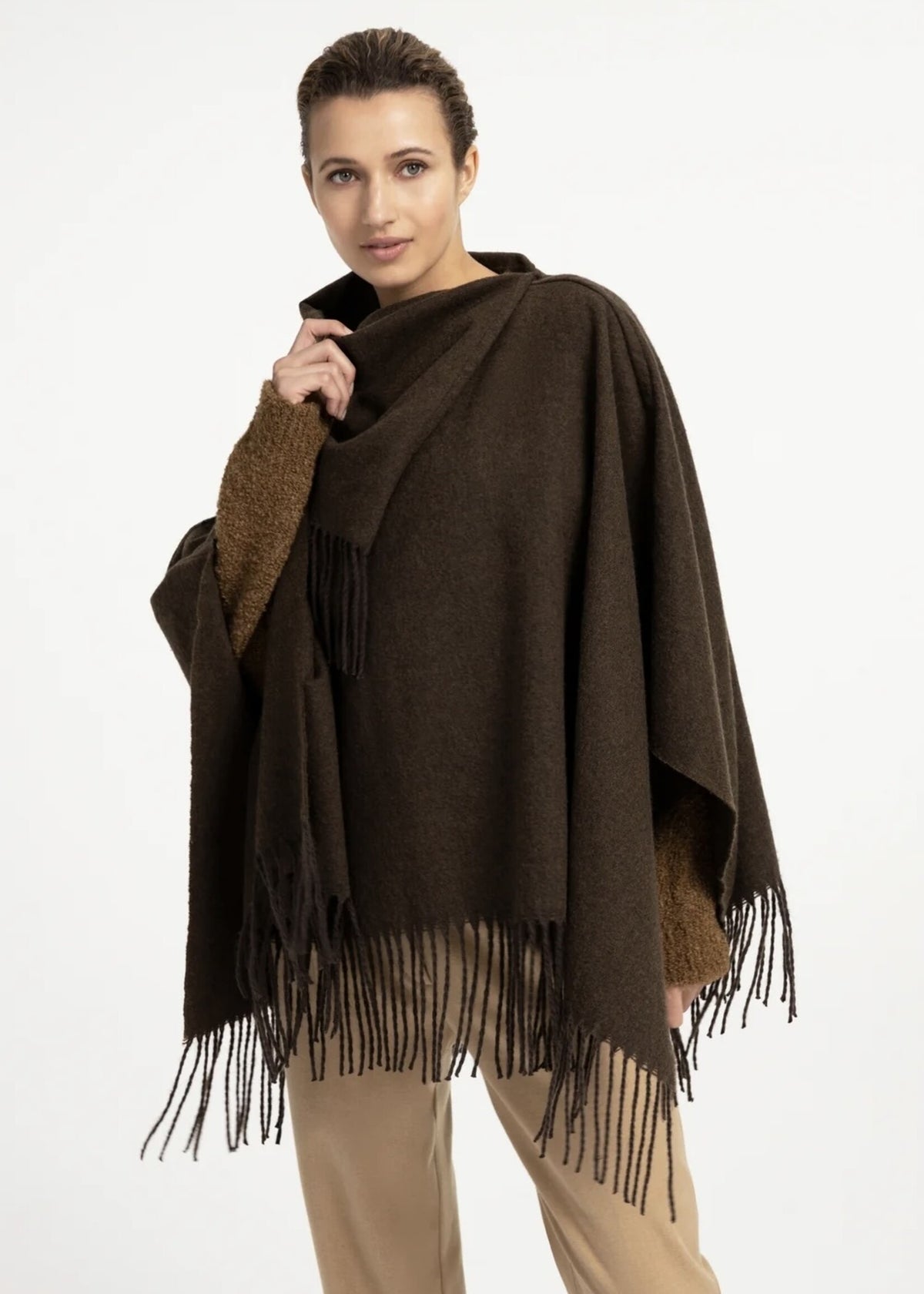 Dark brown wool blend poncho with twisted self-fringes and high wrap neckline